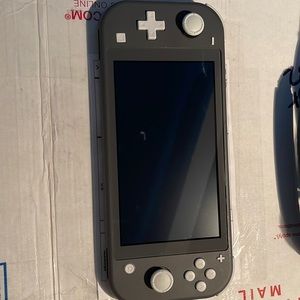 Nintendo Switch Lite console with two carrying cases and charger